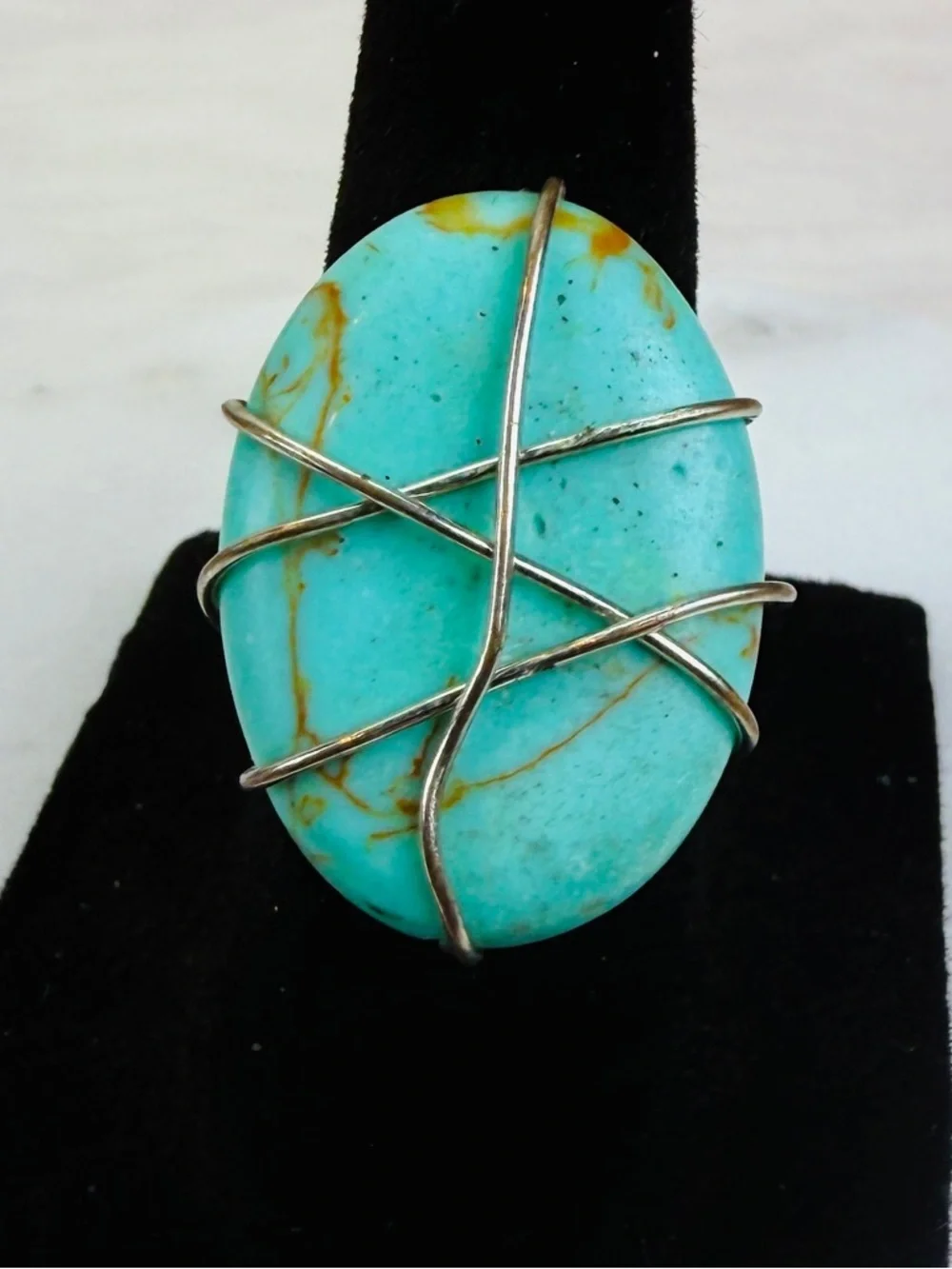 Aged silvertone, wire wrapped blue center size 6 adjustable costume ring